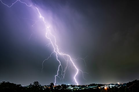 Dramatic lightning strikes illuminating the dark sky